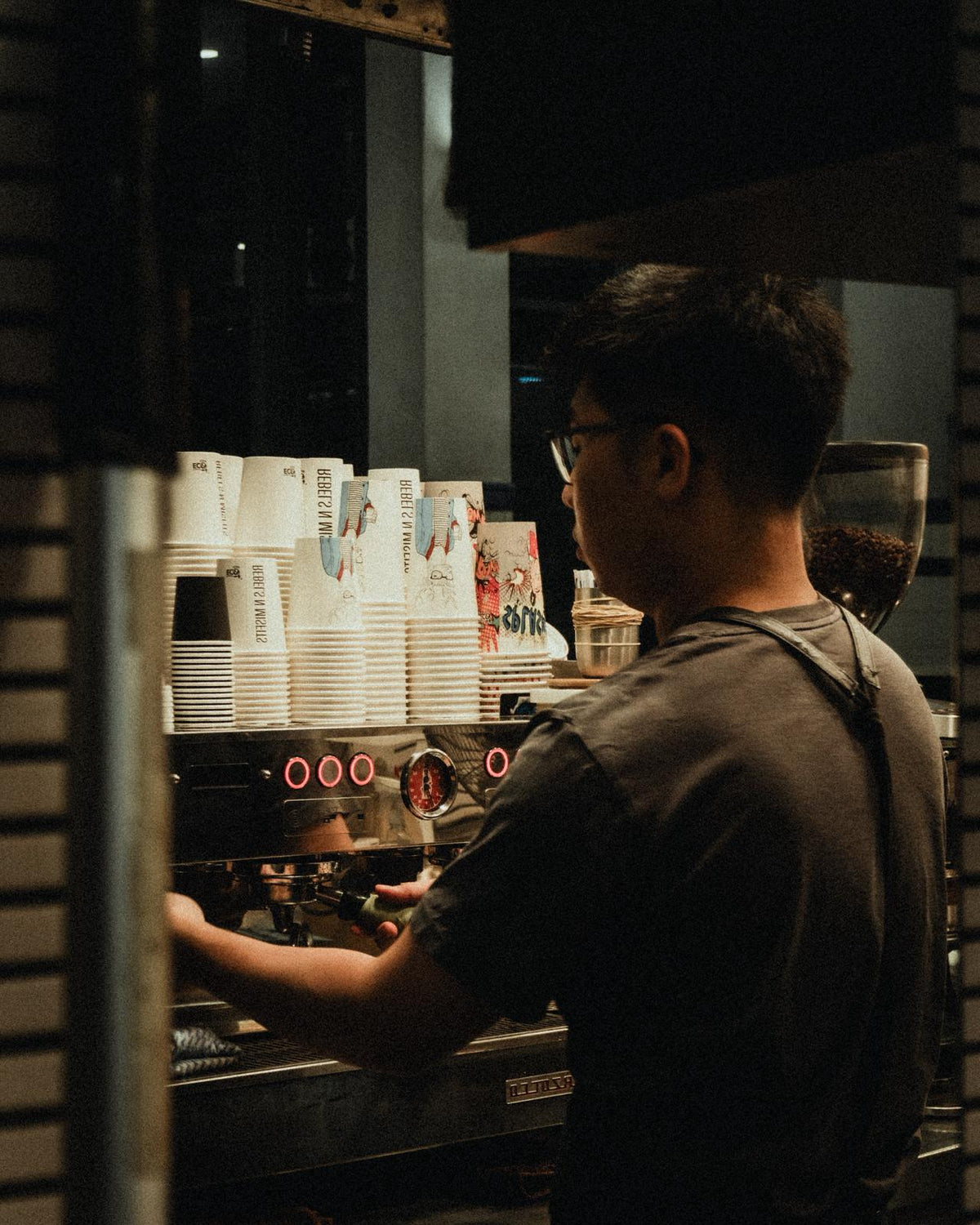 A Rebels N Misfits barista pulling a shot